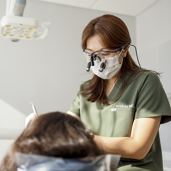 Periodontist treating a patient