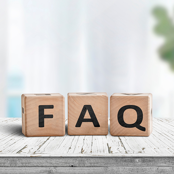 Wooden block letters spelling out FAQ