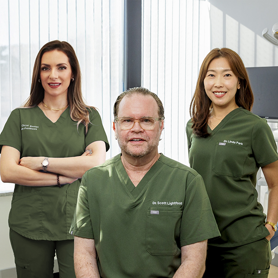 Three smiling periodontists in Braintree