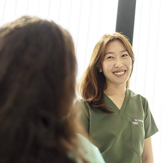 Doctor Park smiling at a patient