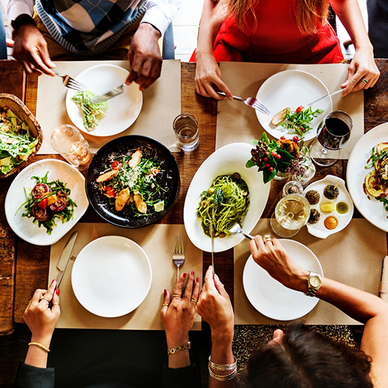 Four people sitting at a dinner table