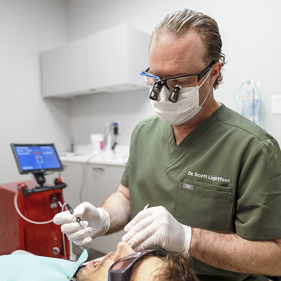 Doctor Lightfoot providing a patient with periodontal services in Braintree