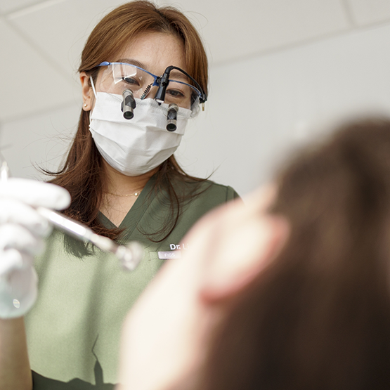Periodontist talking with a patient