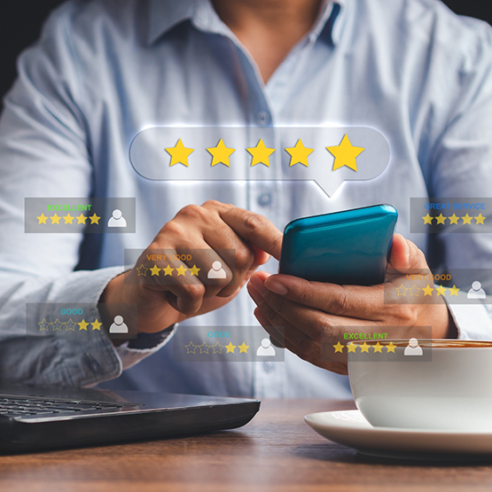 Person leaving a five star review on their phone